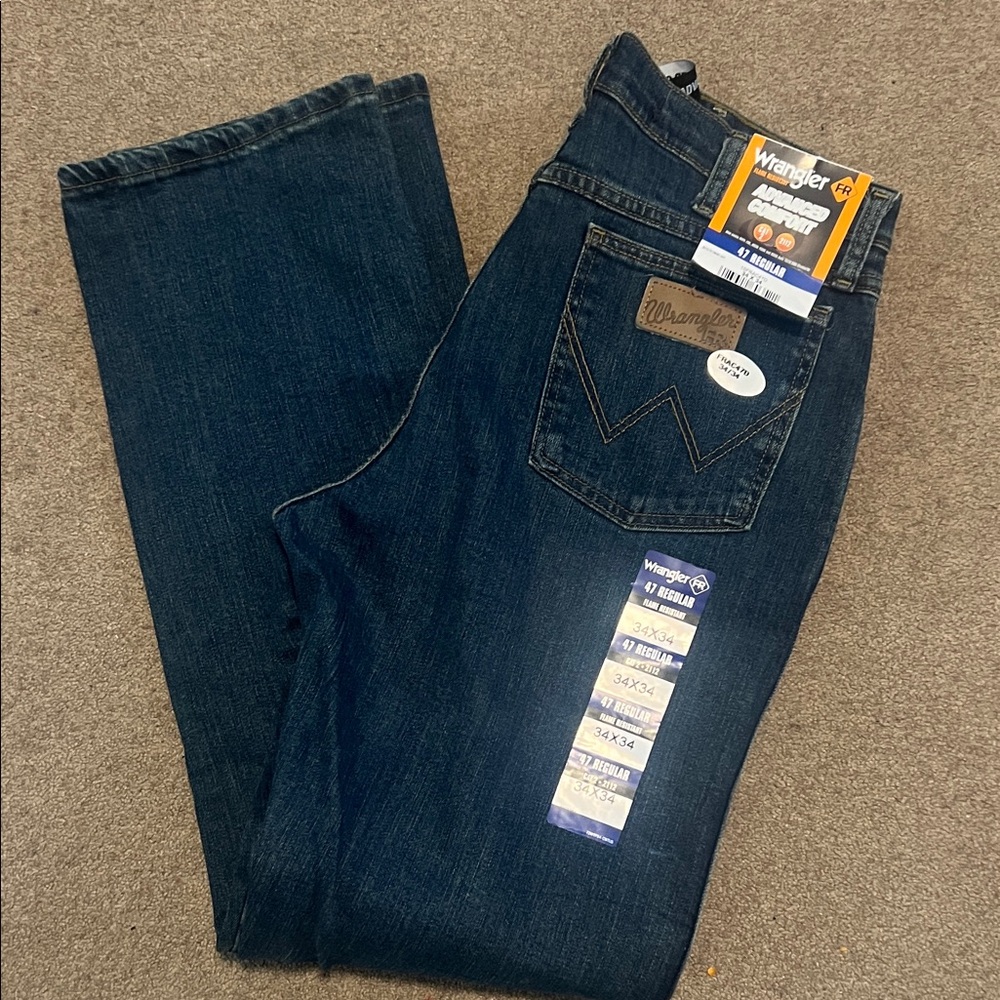 Wrangler Men’s flame resistant advanced comfort dark indigo blue jeans. 34x34